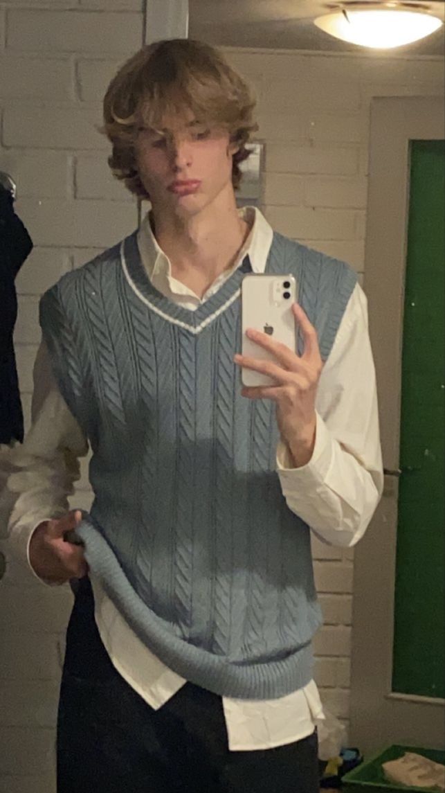 man in blue top mirror shot